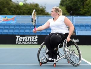 Louise Hunt is pictured striking a tennis ball on court 