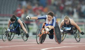 Baroness Tanni Gray-Thompson DBE is pictured crossing the finishing line at the 2004 Paralympics in Athens
